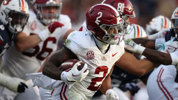 Nov 25, 2023; Auburn, Alabama, USA; Alabama Crimson Tide running back Jase McClellan (2) carries against the Auburn Tigers during the second quarter at Jordan-Hare Stadium.